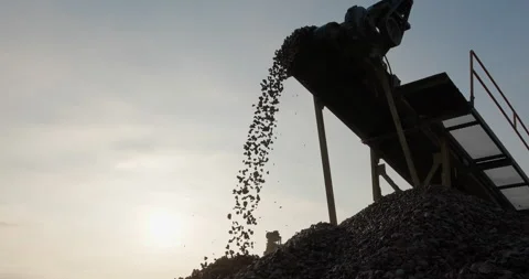 Crushing screening in open-pit mining. Sorted rocks move on conveyor belt, fall Stock Footage 290117168