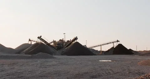 Crushing screening plant. Mining conveyor belt pour sorted gravel and sand into Stock Footage 288716388