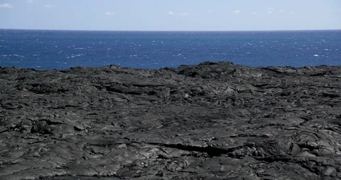 Crust formation after volcanic eruption near the sea Stock Footage 93605352