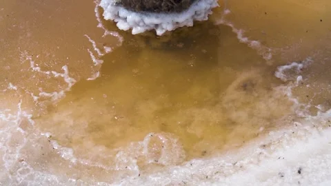 A crust of salt on the surface of a hypersalted lake, like ice. Ice salt current Stock Footage 342058355