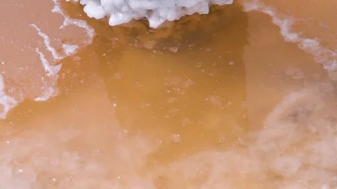A crust of salt on the surface of a hypersalted lake, like ice. Ice salt current Stock Footage 342058457