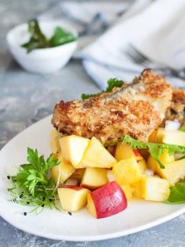 Crusted cod with peach and pineapple salsa Stock Photos