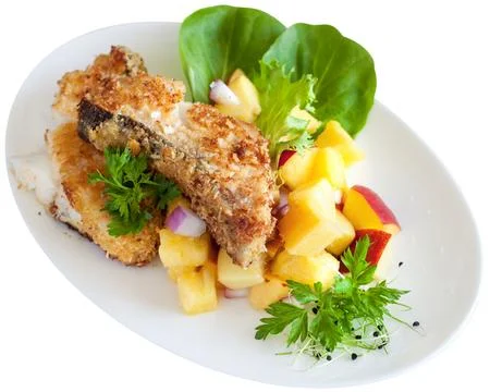 Crusted cod with peach and pineapple salsa Stock Photos