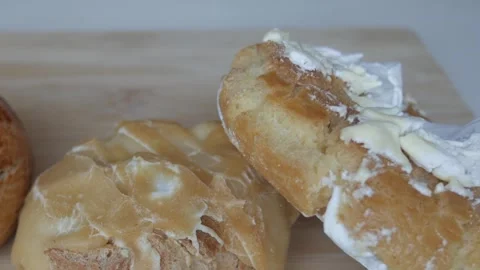 Crusty and crumbly dough with different coloured icing biscuits traditional Stock Footage 341509511