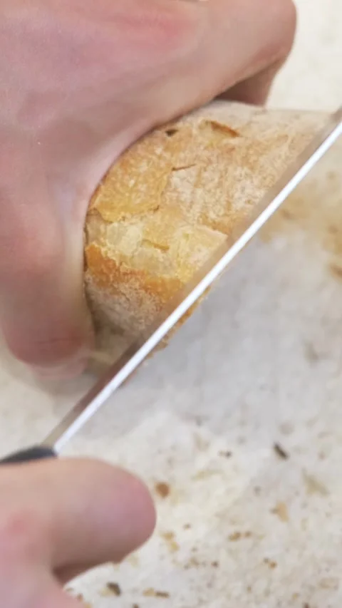 Crusty Bread Loaf Being Sliced for Bruschetta, Restaurant Kitchen Scene Stock Footage 336793757