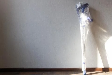 Crutches against the wall. The need to help people with disabilities. Disability Stock Photos
