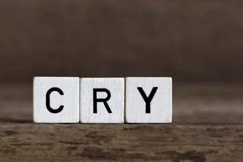 Cry, written in cubes Stock Photos