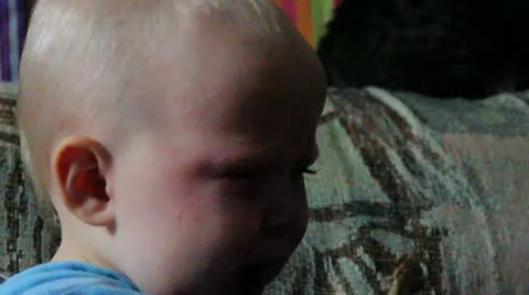 Crying and sick, a girl eats her snack Stock Footage 17160692