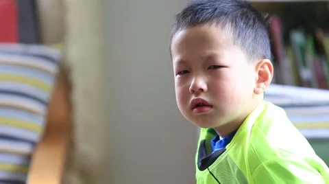 Crying Asian boy at home Stock Footage 49937980