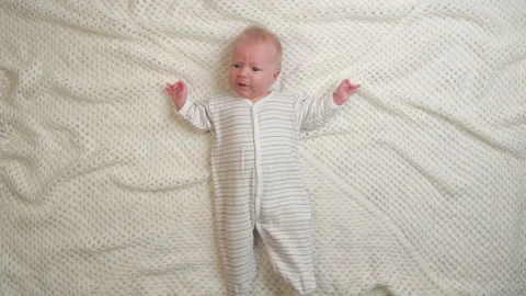 Crying baby in bed Stock Footage 220327557