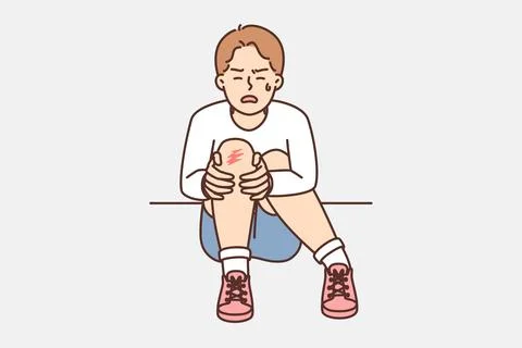 Crying boy sits on ground and holds on to injury on knee after fall during walk Stock Illustration