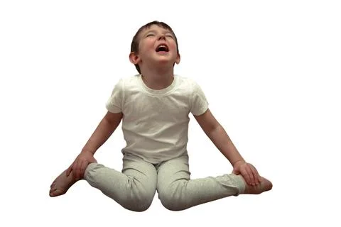 Crying child sitting on floor isolated on white background. Little boy shou.. Stock Photos