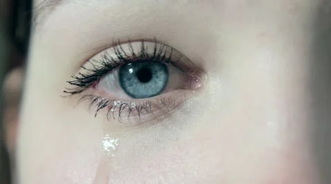 Crying girl with tears in her beautiful eyes in 1080p close up Stock Footage