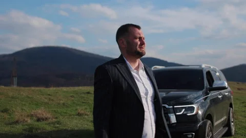 A crying man raises his hands and looks far into the horizon. Stock Footage 169394288