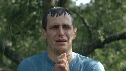 Crying man under the rain Stock Footage 132598181