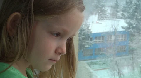 Crying Sad Child Looking Out Window, Snowing, Unhappy Little Girl, Children Stock Footage