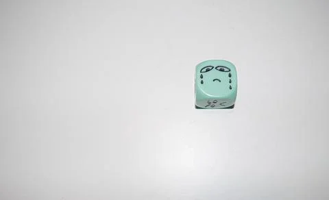 Crying Sad Face Hand-Drawn on Mint Die Stock Photos