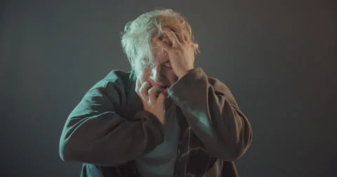 Crying while sitting Stock Footage 157944988