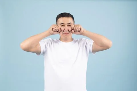 Crying Young Man Pretending to Weep Stock Photos