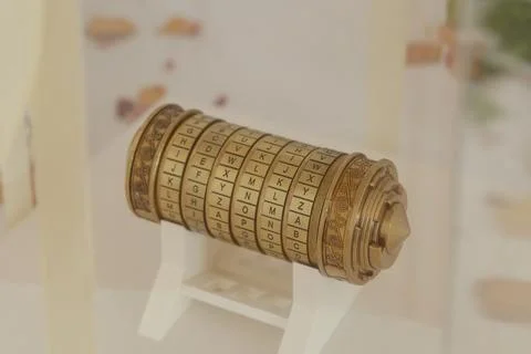 Cryptex combination lock showing alphabet letters on rings, placed on white.. 스톡 사진