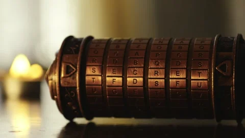 Cryptex word code puzzle spells out 'secret' in candlelit escape room Video stock 304153831