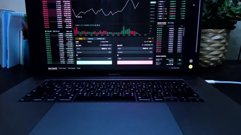 Crypto chart values, trading statistics and analytics on laptop | Stock market Stock Footage 148894080