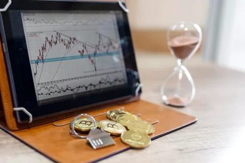 Crypto currency and graph analysis on tablet Stock Photos