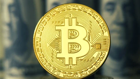 Crypto currency is bitcoin. BTK shoot close up. Bitcoin on dollars background Stock Footage 88856808