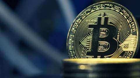 Crypto currency, bitcoin on a dark background with flashing lights. BTC, Bit Video stock 88472252