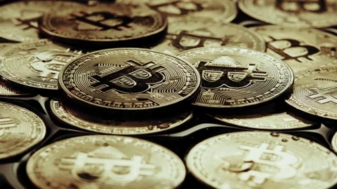 Crypto currency Bitcoin extreme close up stock footage. Golden BTC coins.  Stock Footage 253576655