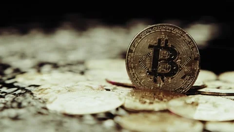 Crypto currency Bitcoin extreme close up stock footage. Golden BTC coins.  Stock Footage 253576853