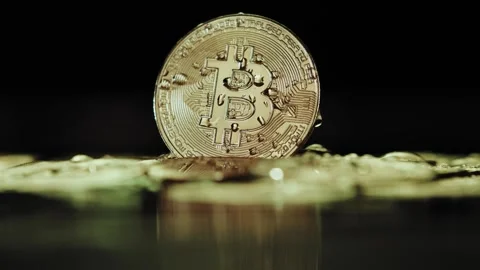 Crypto currency Bitcoin extreme close up stock footage. Golden BTC coins.  Stock Footage 253576863