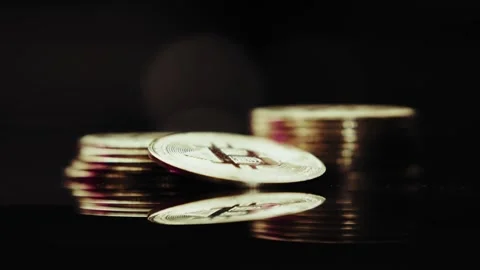 Crypto currency Bitcoin extreme close up stock footage. Golden BTC coins.  Stock Footage 253577044