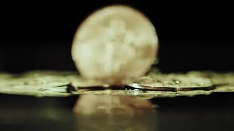 Crypto currency Bitcoin extreme close up stock footage. Golden BTC coins.  Stock Footage 253577048