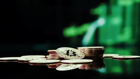 Crypto currency Bitcoin extreme close up stock footage. Golden BTC coins.  Stock Footage 253577057