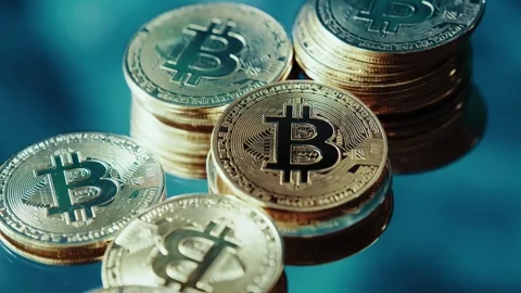 Crypto currency Bitcoin extreme close up stock footage. Golden BTC coins.  Stock Footage 253577905