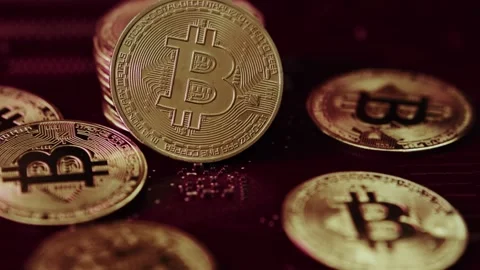Crypto currency Bitcoin extreme close up stock footage. Golden BTC coins.  Stock Footage 253577934