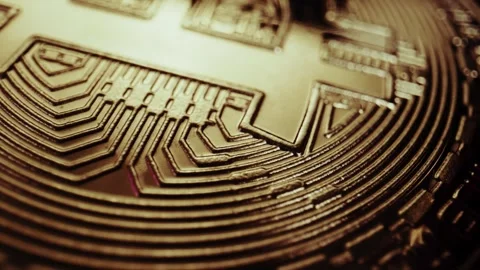 Crypto currency Bitcoin extreme close up stock footage. Golden BTC coins.  Stock Footage 253578448