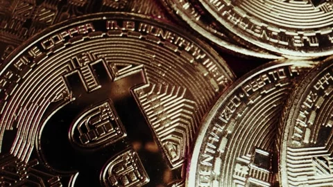 Crypto currency Bitcoin extreme close up stock footage. Golden BTC coins.  Stock Footage 253578593