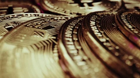 Crypto currency Bitcoin extreme close up stock footage. Golden BTC coins.  Stock Footage 253578723