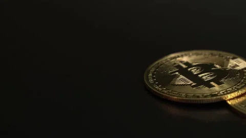 Crypto currency. Blockchain technology, bitcoin miningTwo gold BITCOIN BTC on Stock Footage 129866404