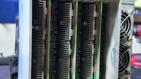 Crypto miner machine zoom out close up card slots and heat sinks Stock Footage 327608010