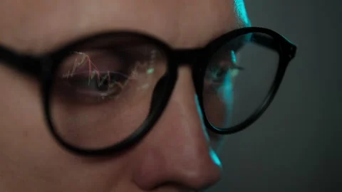 Crypto Trader Watching at Computer Screen while Analyzing online Stock Trading Stock Footage 306942271