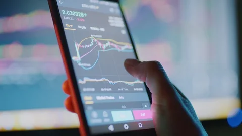 Crypto trading on a smart phone Stock Footage 107116852