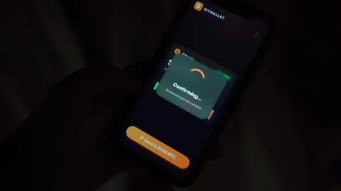 Crypto wallet app with balance and price chart on smartphone screen in dark room Видео 343238447