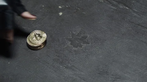 Crypto - A woman hand pushes a batch of gold Bitcoins. Stock Footage 92113387