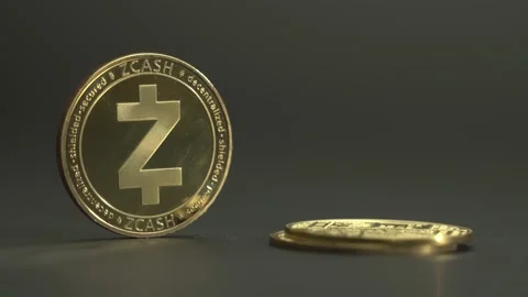 Cryptocoin ZCASH on grey surface. Man's hand put some gold coins on the table Video stock 132489835