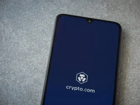 Crypto.com app launch screen on smartphone on ceramic stone background Stock Photos