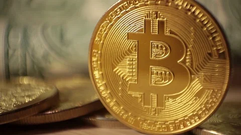 Cryptocurrency Bitcoin and dollars. Bit coins and cash Stock Footage 83212726