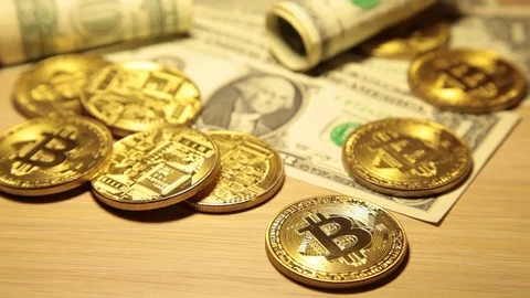 Cryptocurrency Bitcoin and dollars. Bit coins and cash Stock Footage 83212730
